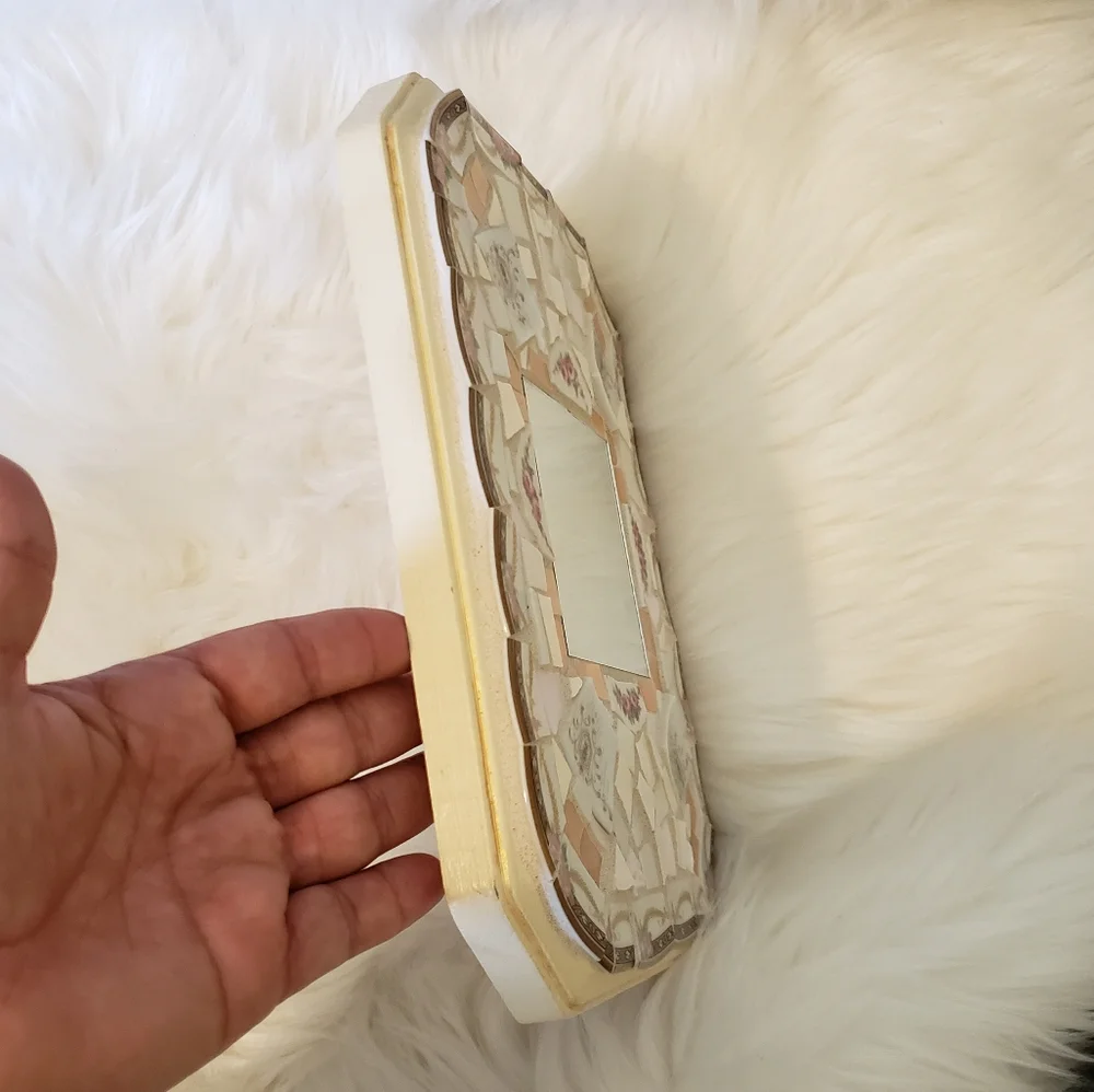 Genuine pique assiette mirror